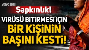 Virüsü bitirmesi için bir kişinin başını kesti