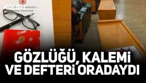 Gözlüğü kalemi ve defteri oradaydı