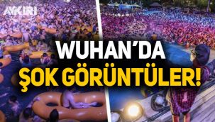 Virüsün dünyaya yayıldığı Wuhan'da binlerce kişilik havuz partileri başladı
