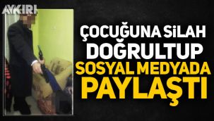 Çocuğuna silah doğrultup sosyal medyada paylaştı
