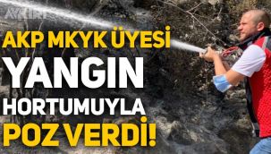 AKP MKYK üyesi Emre Ete, Manavgat'ta yangın hortumuyla poz verdi