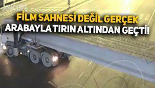 Film değil gerçek: Arabayla hareket halindeki tırın altından geçti