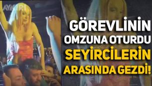 Gülşen korumanın omzuna oturdu, seyircilerin arasında gezdi