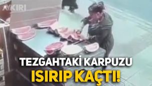 Manav tezgahındaki karpuzu ısırıp kaçan kadın kameralara böyle yansıdı
