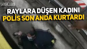 ABD'de fenalaşarak raylara düşen kadını polis böyle kurtardı