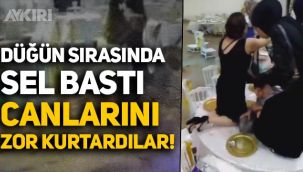 Düğün sırasında sel bastı, masaların üzerine çıkarak canlarını zor kurtardılar