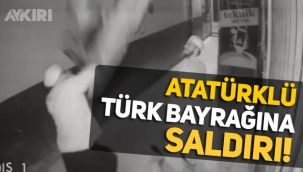 Trabzon'da Kunduracılar Caddesi'ndeki bir işyerine asılı Atatürk baskılı Türk bayrağı indirilip, yere atıldı