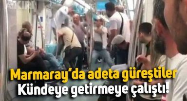 Marmaray'da iki yolcu adete güreşti: Kündeye getirmeye çalıştı