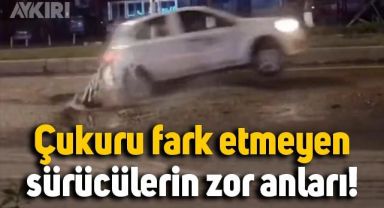 Su birikintisinden yoldaki çukuru görmeyen sürücülerin zor anları