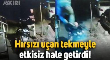 Kurye, motosikletini çalmaya çalışan hırsızı uçan tekmeyle durdurdu