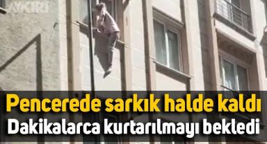İstanbul'da pencerede sarkık halde kaldı, dakikalarca kurtarılmayı bekledi