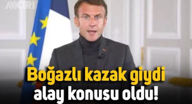 Boğazlı kazak giyen Emmanuel Macron,