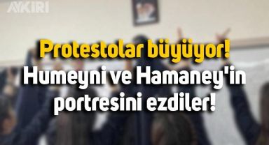 İran'da öğrenciler Humeyni ve Hamaney'in portresini ezip yırttı