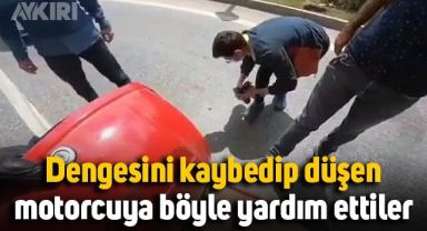 Trafikte dengesini kaybedip düşen motorcuya böyle yardım ettiler