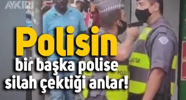 Brezilya'da polisin, bir başka polise silah çektiği anlar kameraya yansıdı