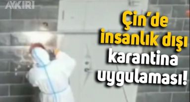 Çin, karantinaya alınan binaların kapılarını demirlerle kapatıyor