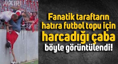 Hollanda'da bir taraftarın maçtaki topu almak için uğraş verdiği anlar kameralara böyle yansıdı