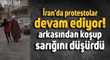 İran'da genç bir kız, yolda yürüyen bir şahsın başındaki sarığı yere düşürdü