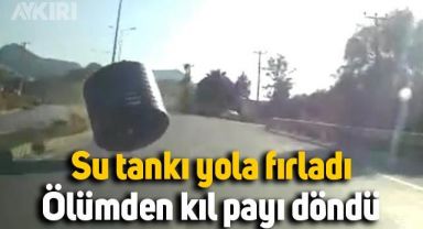 Kamyon kasasından yola düşen su tankından son anda manevra yaparak kurtuldu