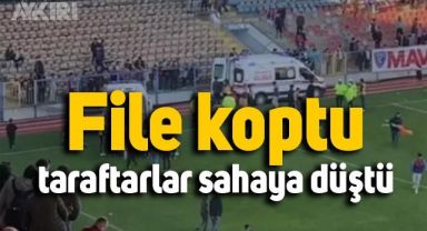 Karabük'te onlarca taraftar filenin kopmasıyla birlikte tribünden sahaya düştü