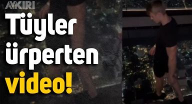 Metrelerce yükseklikte camda yürüyen gencin videosu nabzı yükseltiyor