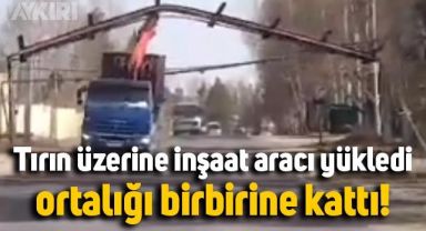 Tırın üzerine inşaat aracı yükledi, ortalığı birbirine kattı