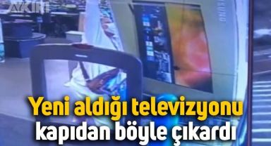 Yeni aldığı son model televizyonu adeta kıra kıra kapıdan çıkardı