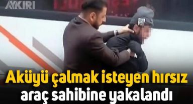 Aküyü çalmak isteyen hırsız, araç sahibine yakalandı