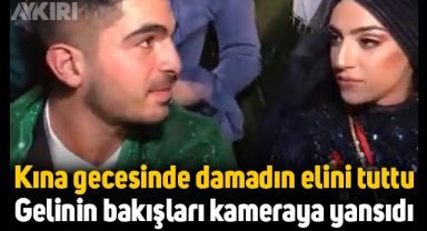 Kına gecesinde damadın elini tuttu, gelinin bakışları kameraya yansıdı