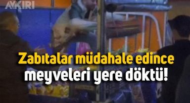 Seyyar satıcı, zabıtanın müdahalesine, meyveleri araçtan atarak karşılık verdi