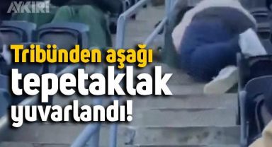Tribünden aşağı tepetaklak yuvarlanan adamın görüntüleri