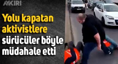 Yola oturarak trafiği kapatan iklim aktivistlerine böyle müdahale ettiler
