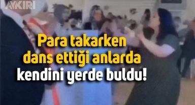 Düğünde gelin ve damada para takarken dans eden davetlinin düştüğü anlar