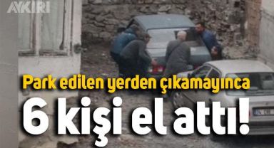 Park edilen yerden çıkamayan aracı, elle çektiler