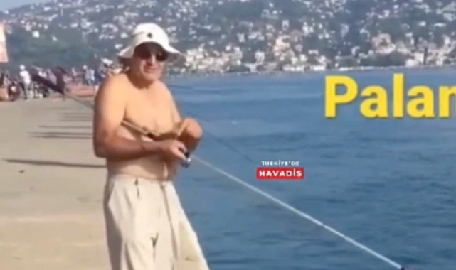 İstanbul'da bir balıkçının oltasından kaçan balık, aracın altında kalarak can verdi
