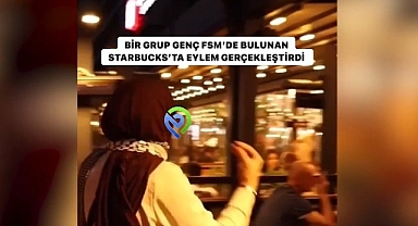 Elindeki Iphone ile Starbucks'a gidip: Sizin içtiğiniz kahvelerle Filistin'de çocuklara bomba atılıyor. dedi.